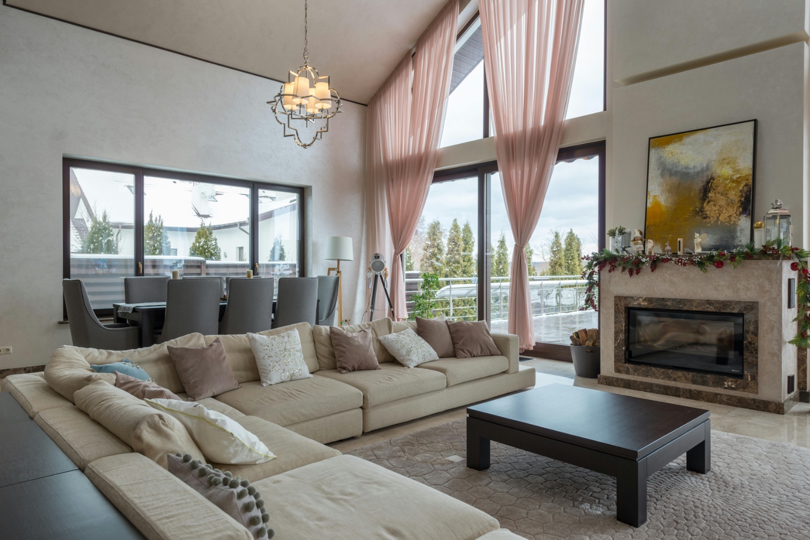 Double-height living room with marble fireplace